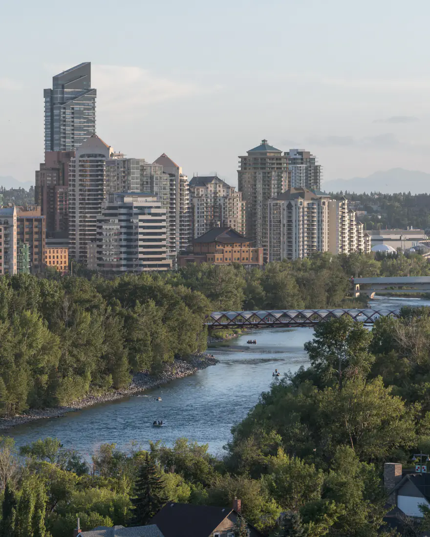 The Bow River and Peace Bridge below Calgary's downtown towers