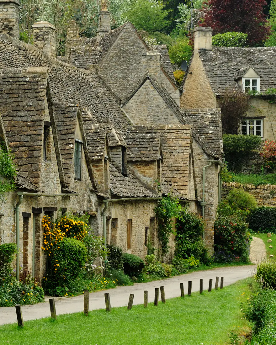 The stone cottages of Arlington Row in Bibury, in the Cotswolds of England