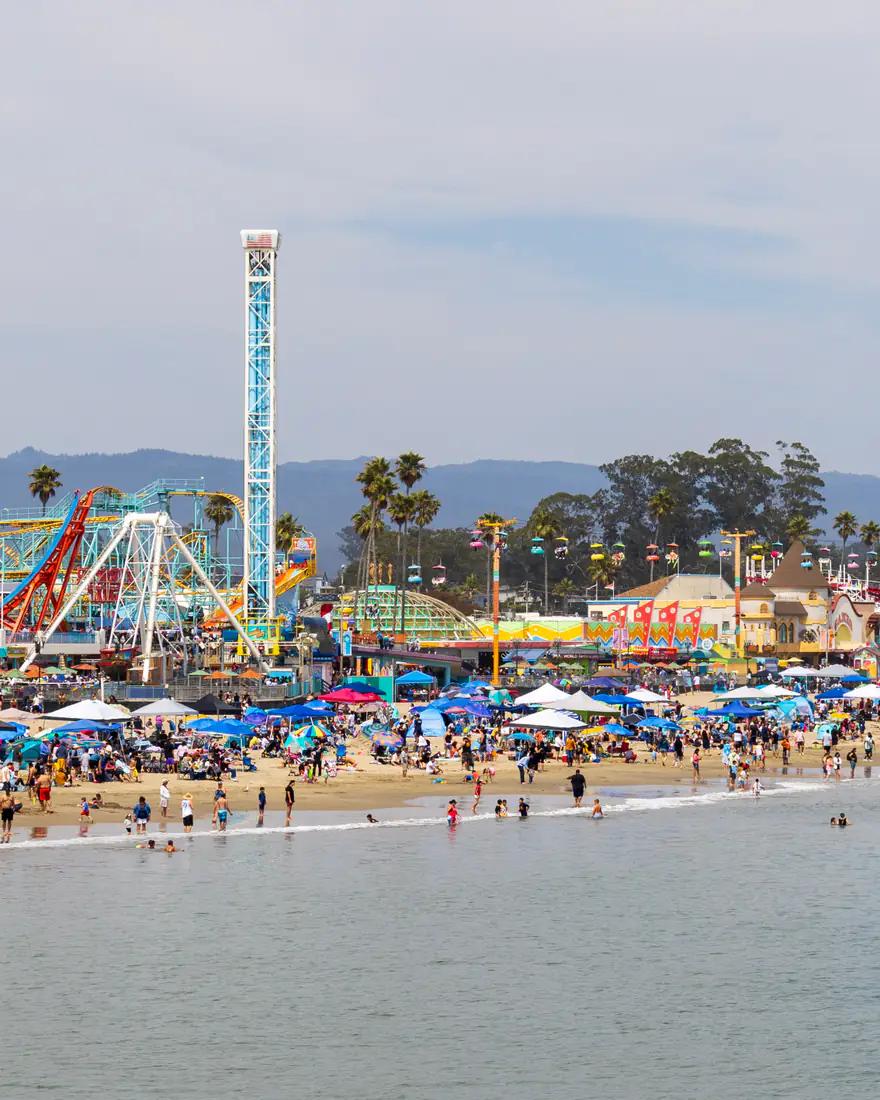 The Santa Cruz Beach Boardwalk and beach on a summer day