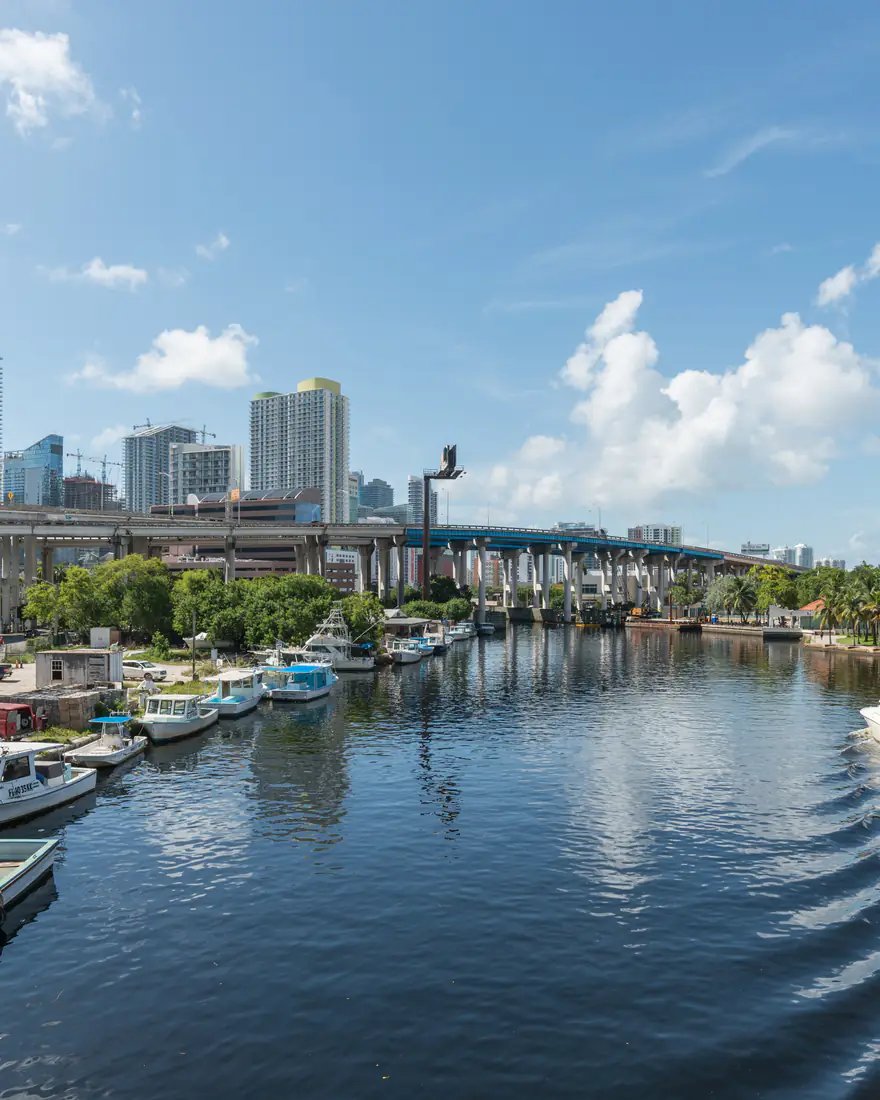 The Miami River lined with boats, leading to downtown Miami