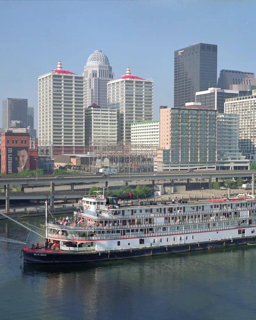 A steamboat on the Ohio River below the Louisville skyline