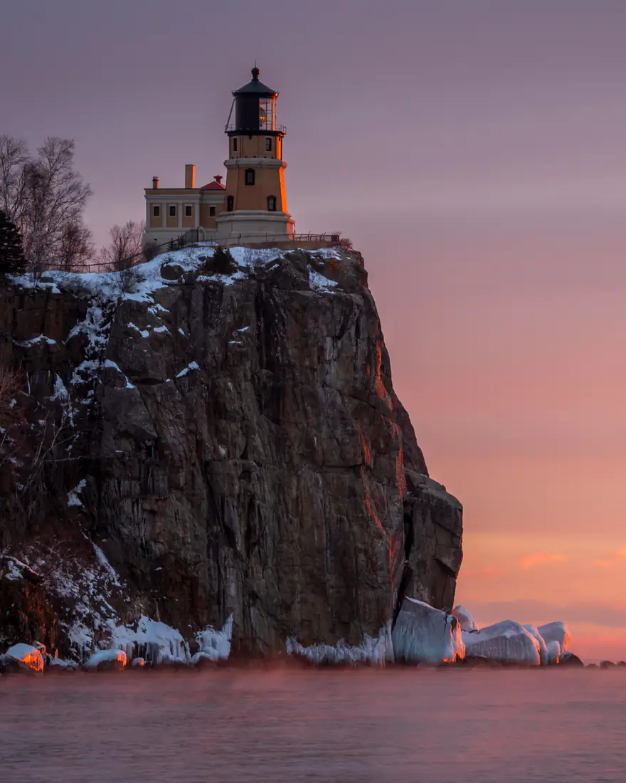Split Rock Lighthouse on its cliff above Lake Superior at sunset
