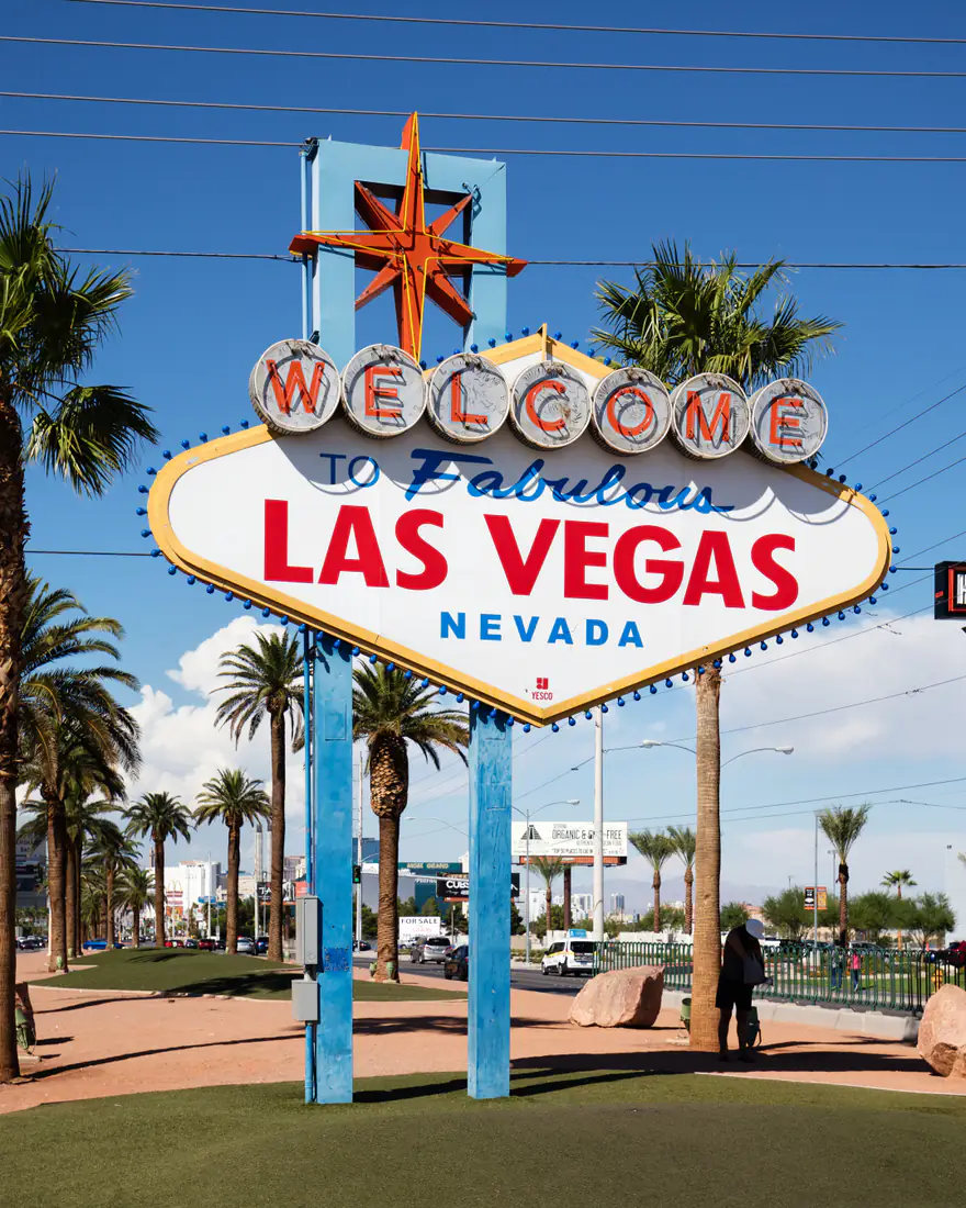 The Welcome to Fabulous Las Vegas sign under palm trees