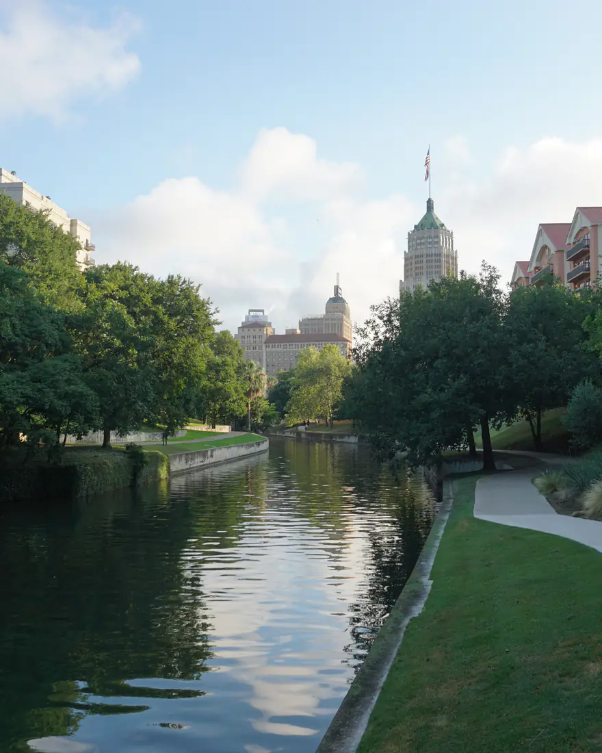 The San Antonio River Walk below downtown towers